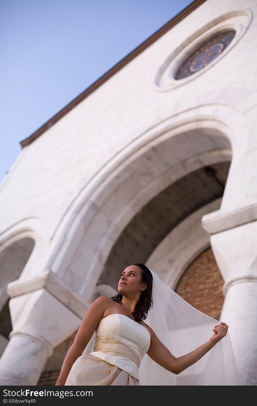 Bride in front of the church. Bride in front of the church