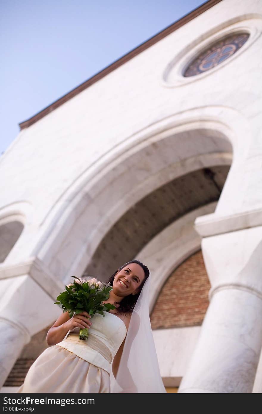 Bride in front of the church. Bride in front of the church