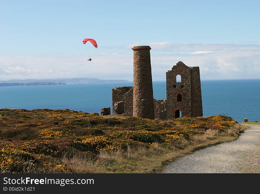 A para glider, gliding past a tin mine on the Cornish coast. A para glider, gliding past a tin mine on the Cornish coast