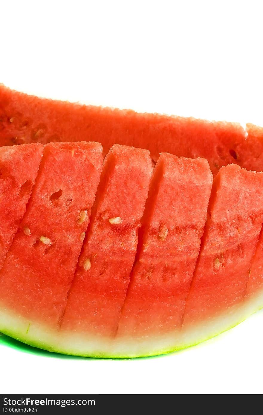 A fresh pair of red and green slices of watermelon. A fresh pair of red and green slices of watermelon