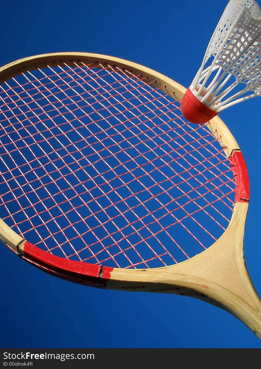 tennis racket with shuttlecock on blue background. tennis racket with shuttlecock on blue background