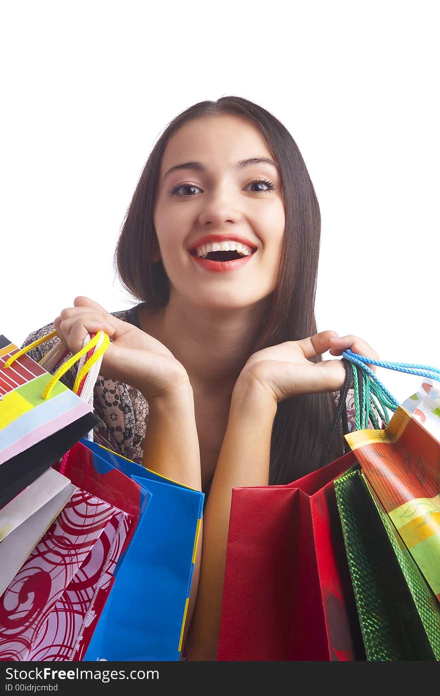 Portrait of young cute brunette with colorful paper bags. Portrait of young cute brunette with colorful paper bags