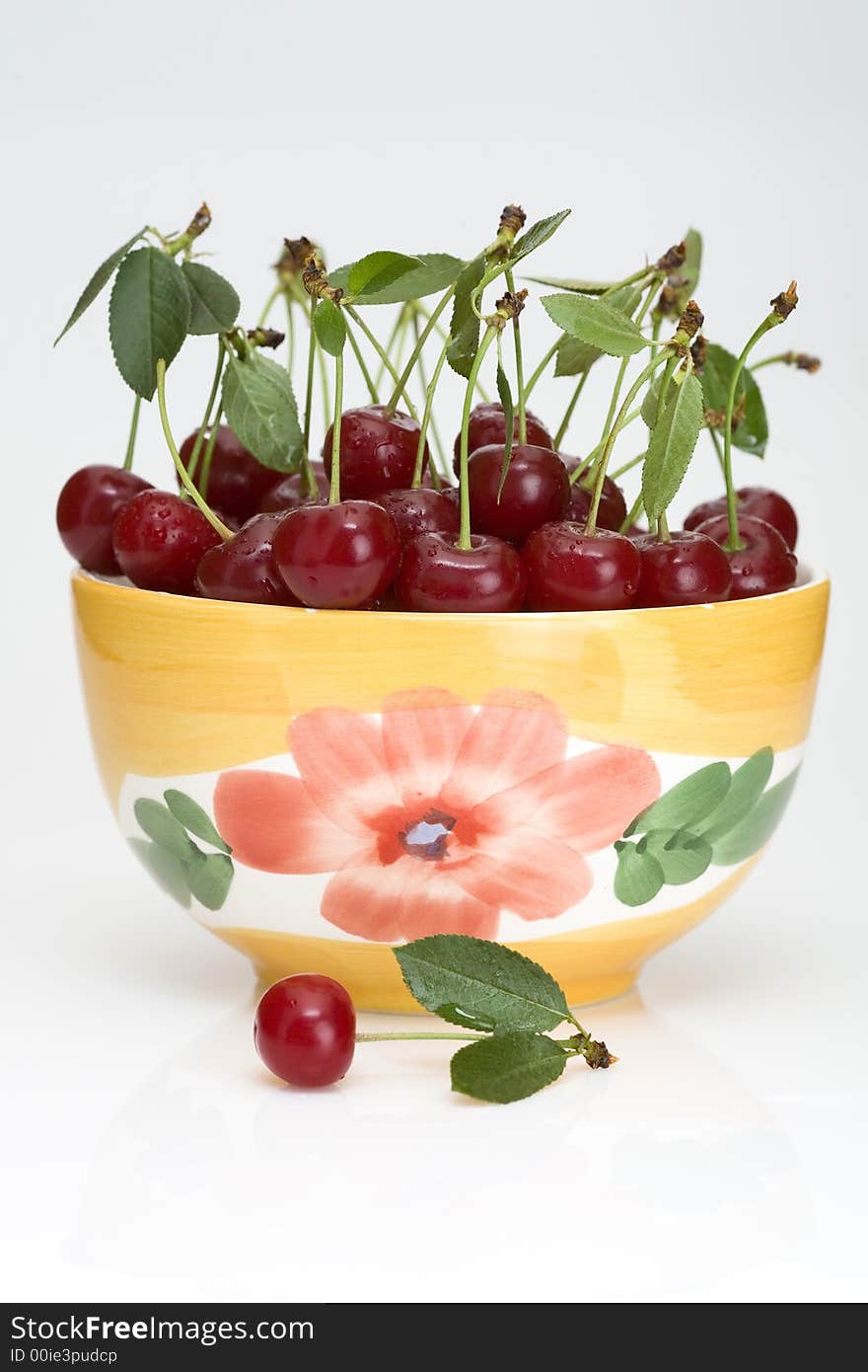 Fresh cherry with green leaf in platter. Fresh cherry with green leaf in platter