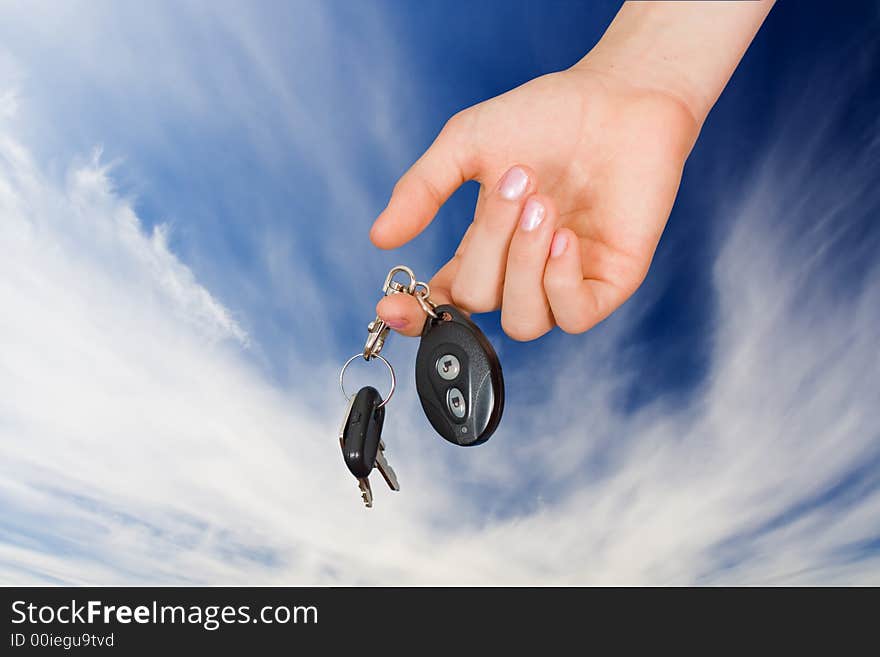 The woman submits a key with a charm from the machine. The woman submits a key with a charm from the machine