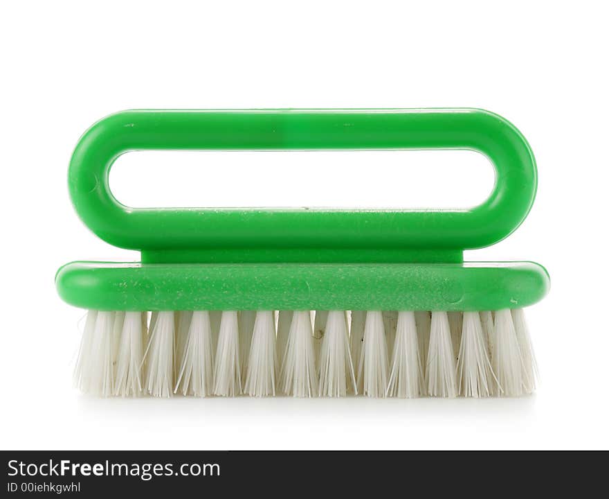 Green clothes-brush isolated over a white background