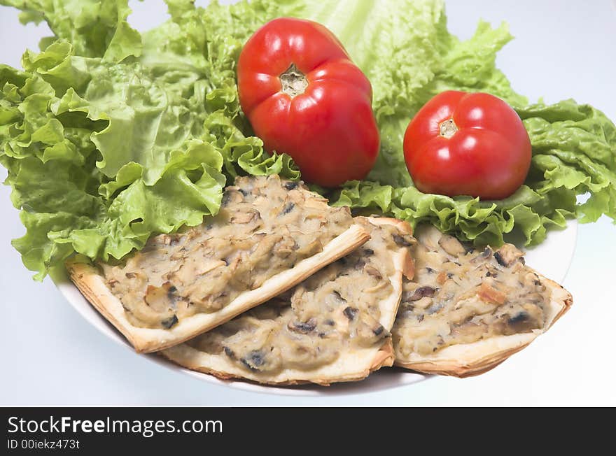 Sandwiches with salad and tomatoes