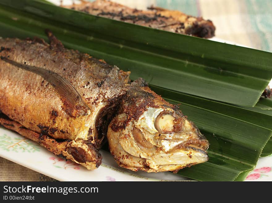 Malaysian pan fried whole mackerel with chili stuffing. Malaysian pan fried whole mackerel with chili stuffing