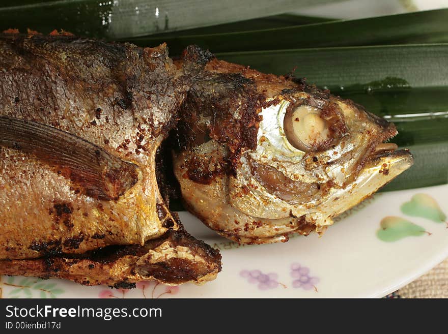 Malaysian pan fried whole mackerel with chili stuffing. Malaysian pan fried whole mackerel with chili stuffing