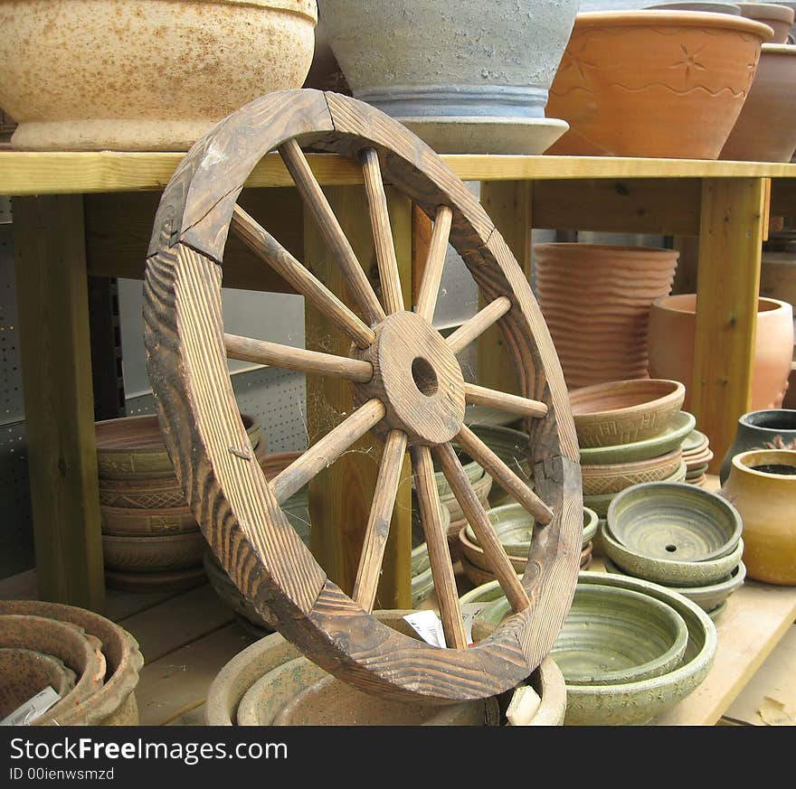 A selection of various shapes and colors of pottery for sale at a market. A selection of various shapes and colors of pottery for sale at a market.