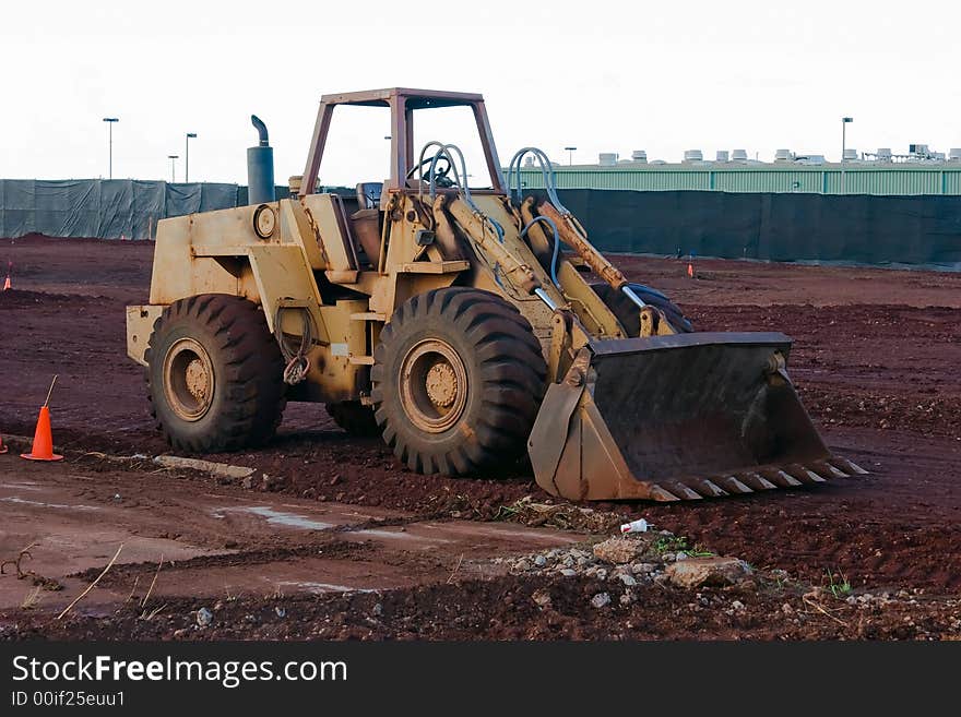 Construction loader at a job site ready to work