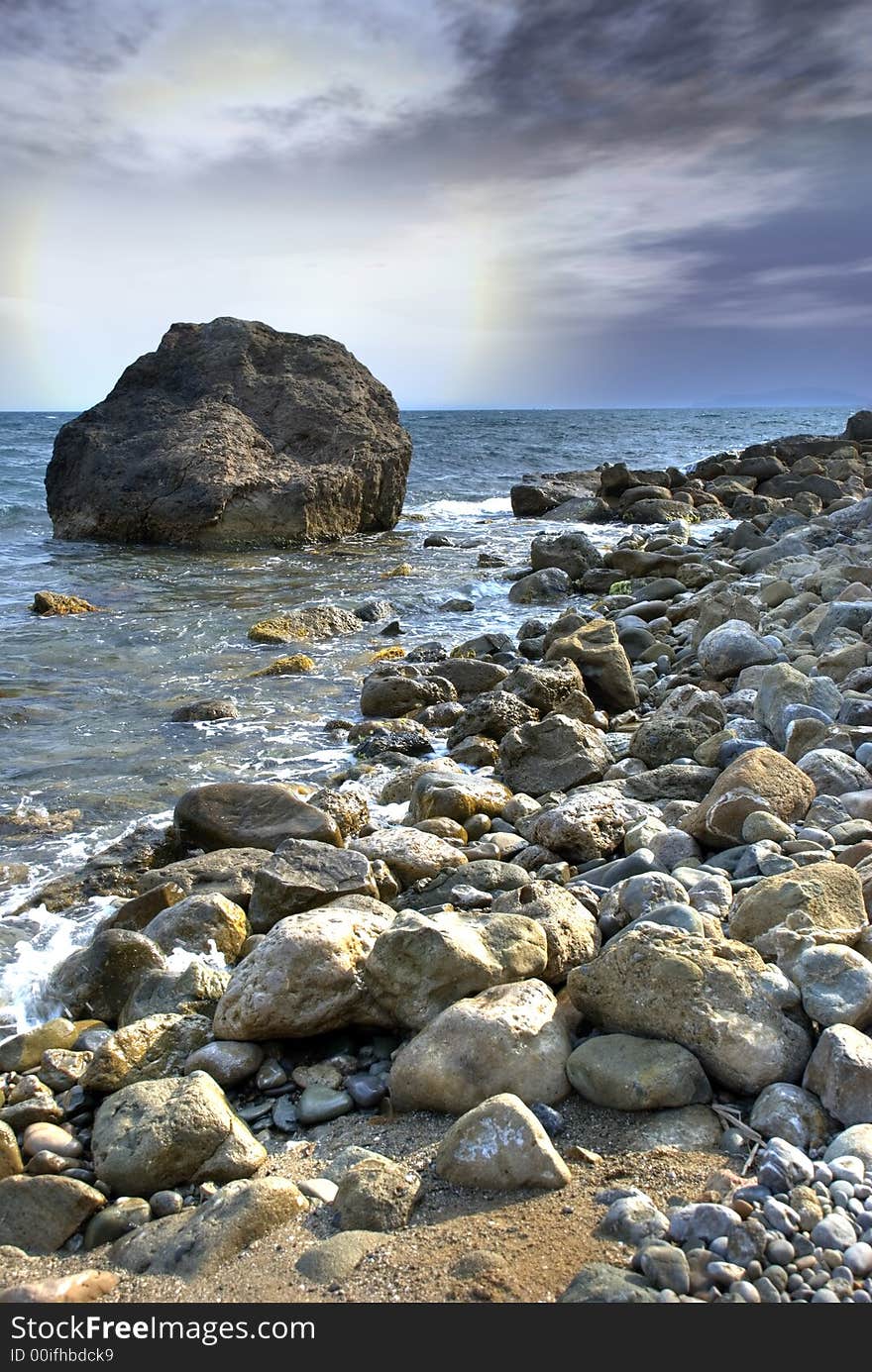 Fantastic decline on coast of ocean with impressive stones on forward the plan