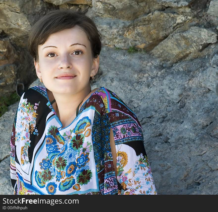 Portrait of the girl on a background of stones. Portrait of the girl on a background of stones.