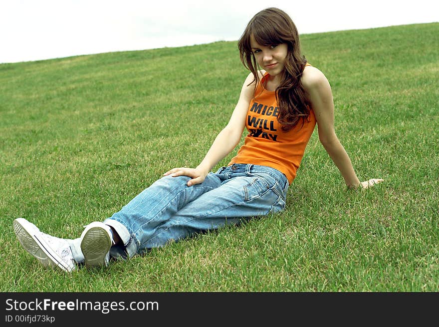 Girl sitting on a grass