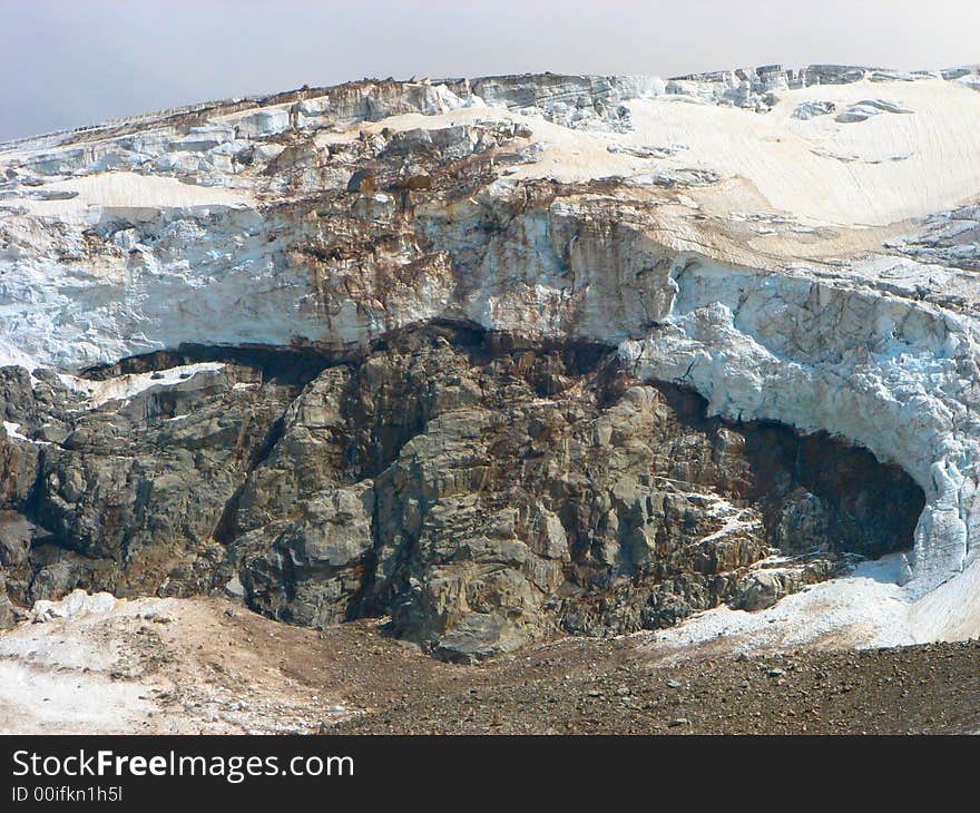 The glacier falls from a rock. The glacier falls from a rock