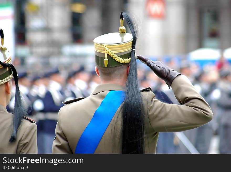 Italian soldier in traditional militar clothes during a fareway to an officier