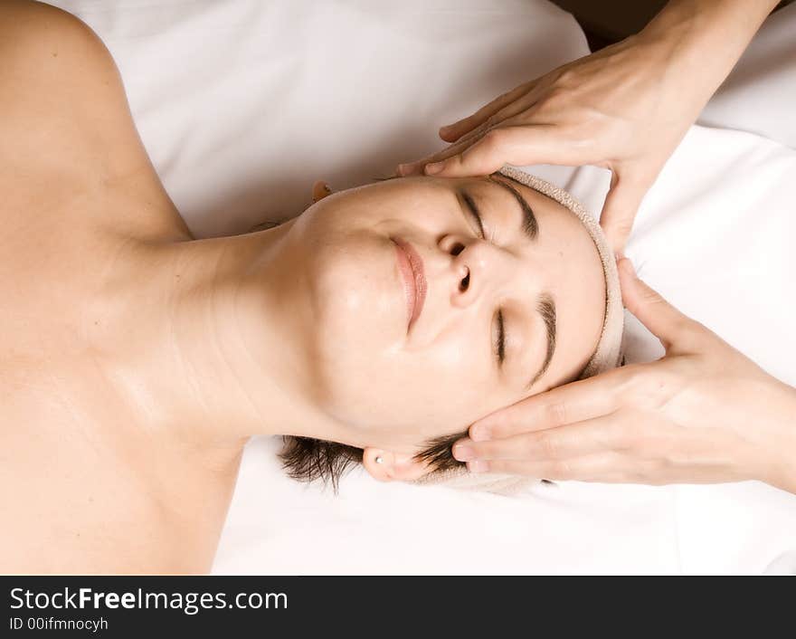 Woman relaxing with a nice facial massage