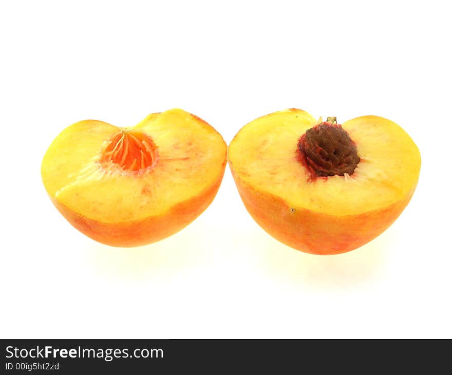 Two halfs of ripe peach on white background. Two halfs of ripe peach on white background