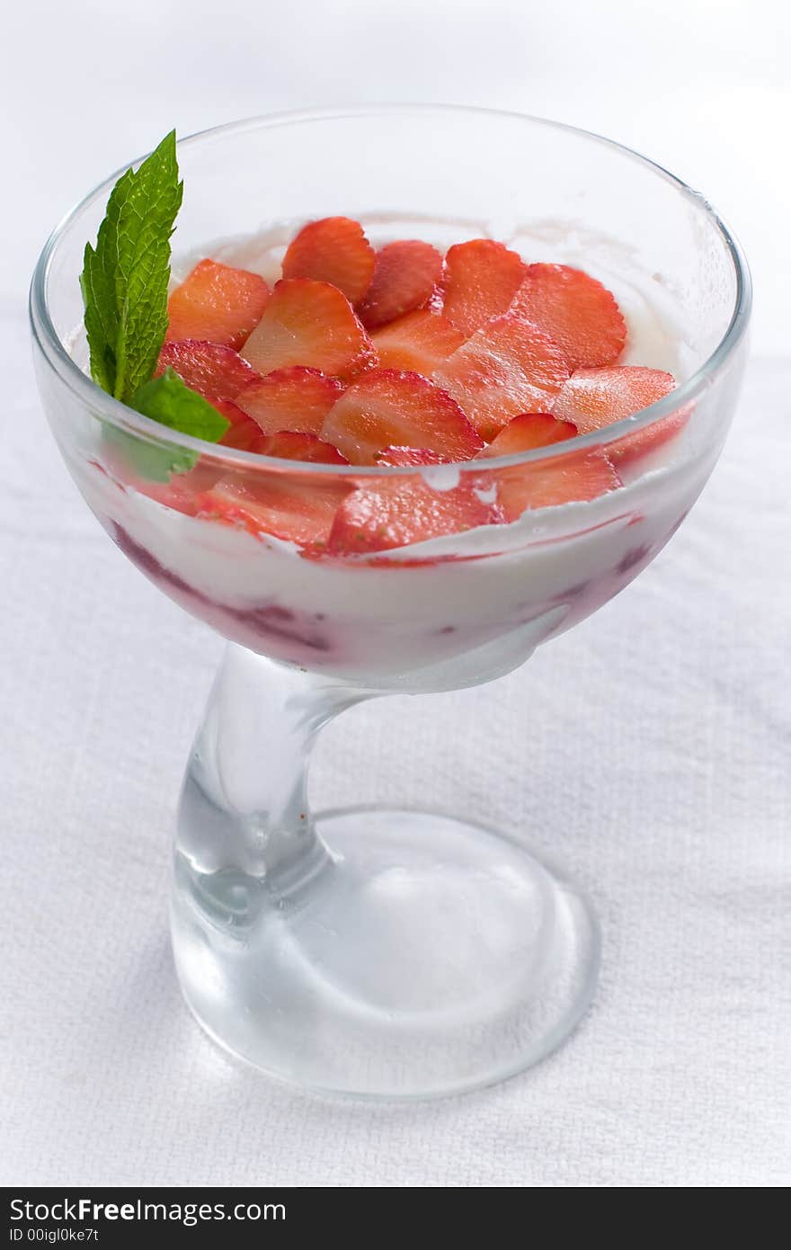 Ice-cream with strawberry in vase