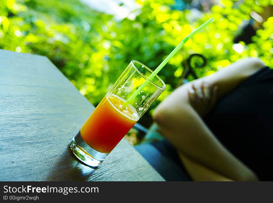 Grapefruit juice in a glass on the table