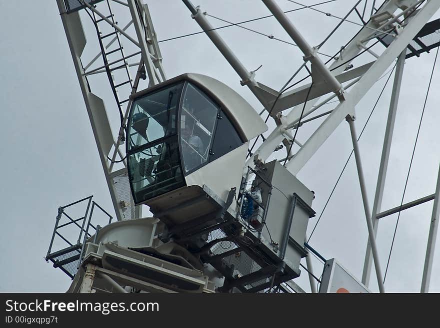 Health and safety at work on a building site with a crane close up. Health and safety at work on a building site with a crane close up