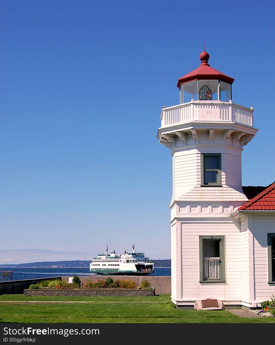 Lighthouse and a boat in the pacific northwest. Lighthouse and a boat in the pacific northwest