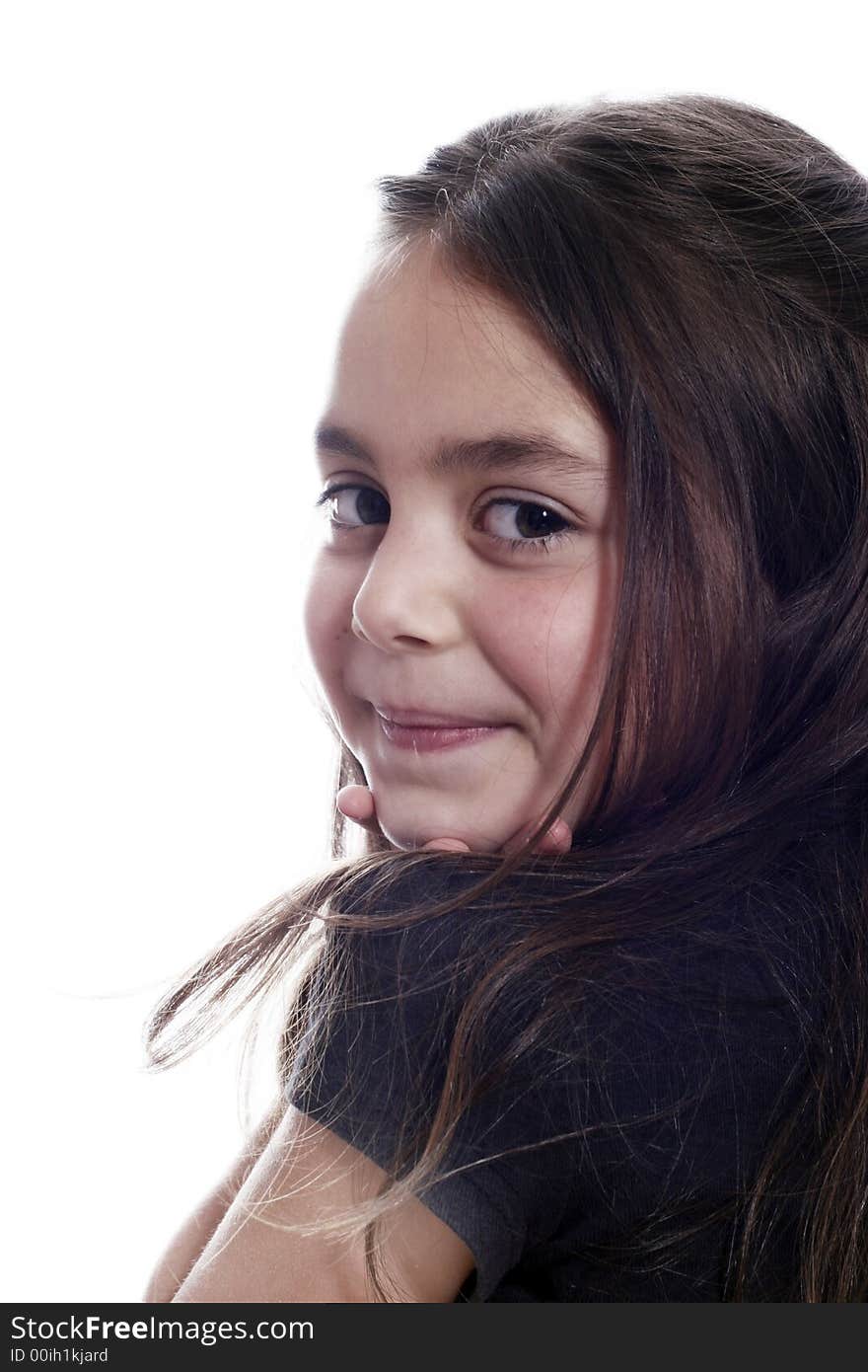 Young girl sitting down and smiling. Young girl sitting down and smiling