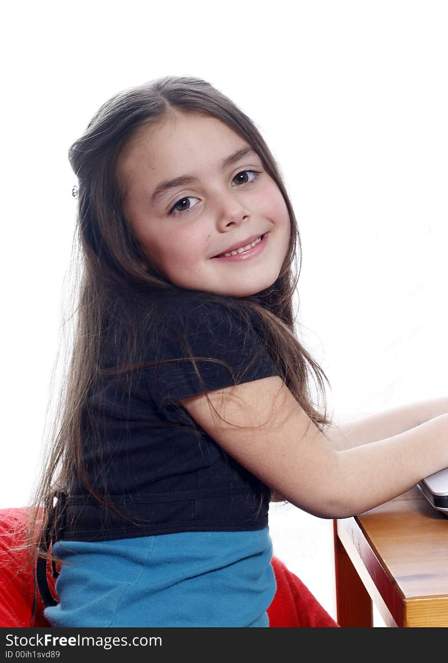 Young girl sitting down and smiling. Young girl sitting down and smiling