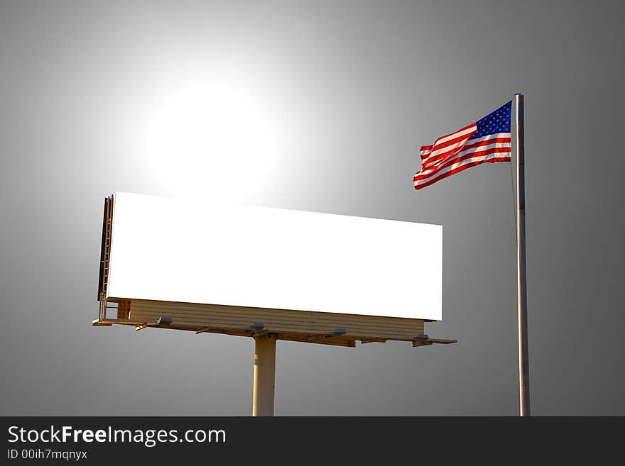 A roadside billboard with an American Flag next to it. The sun was behind the billboard and to the left. A roadside billboard with an American Flag next to it. The sun was behind the billboard and to the left