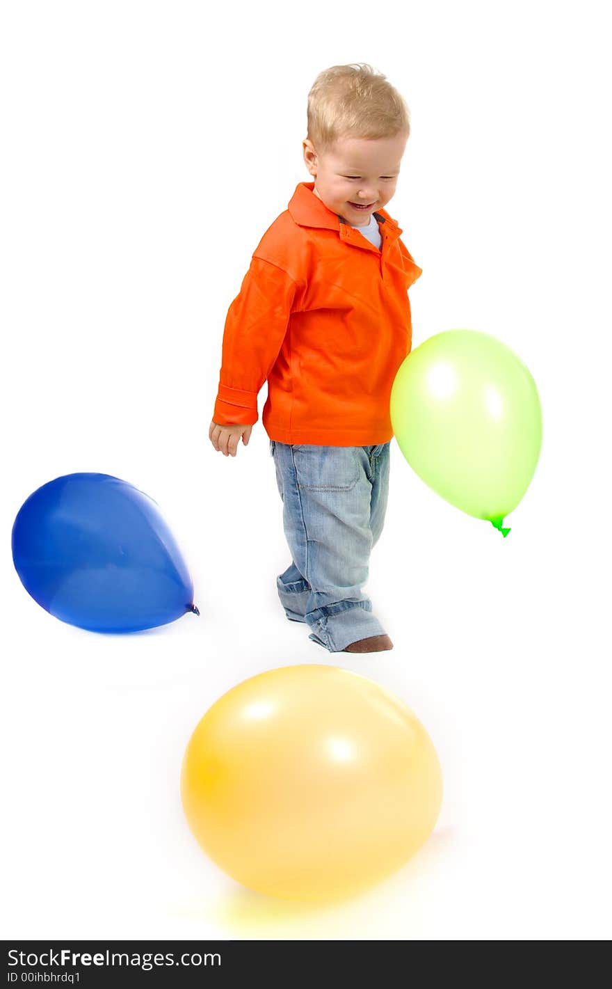 Little boy playing with balloons.