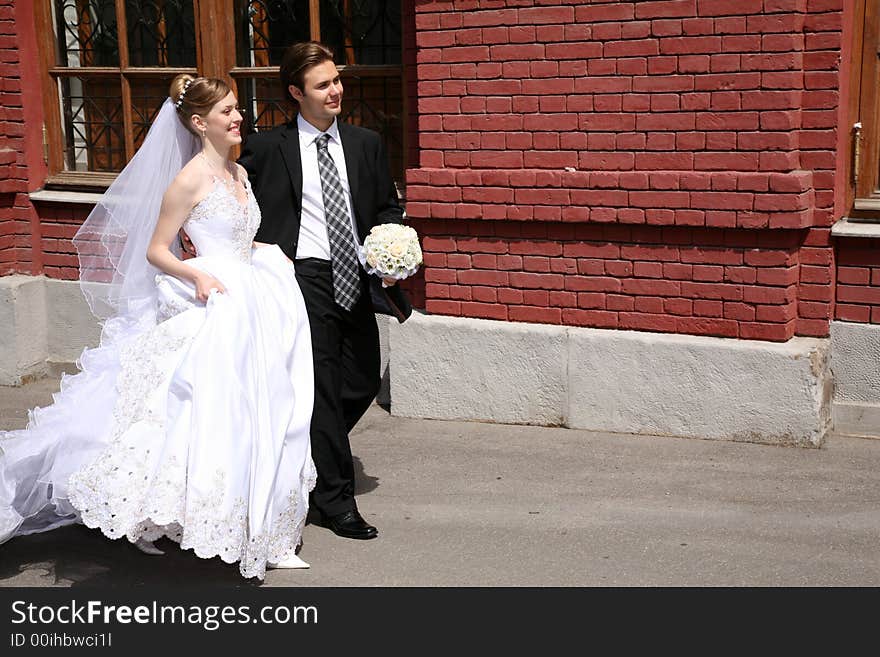 Bride and fiance go on the street