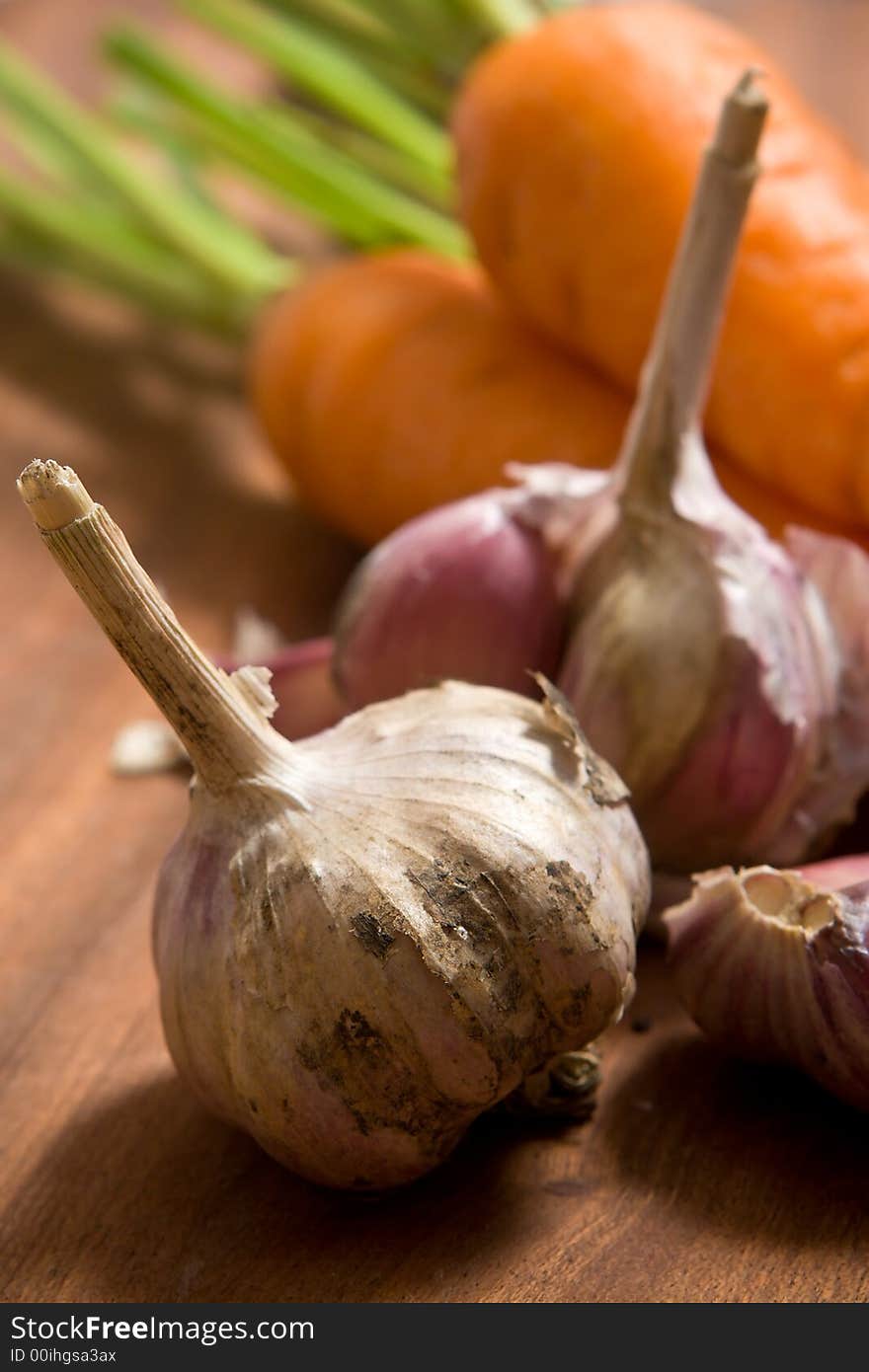 Garlic and carrot on cutting b