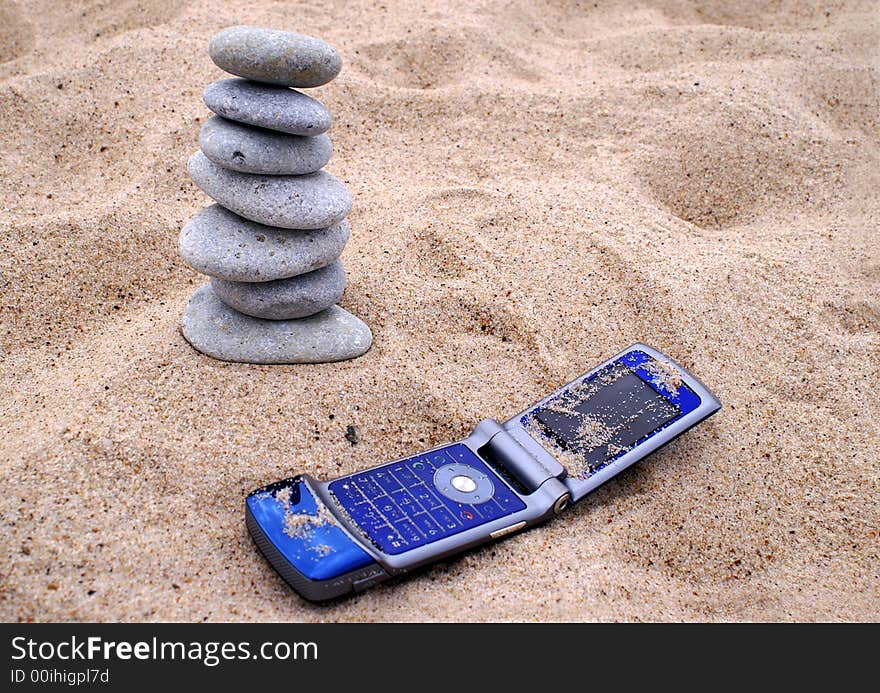 Telephone and pebble stack on