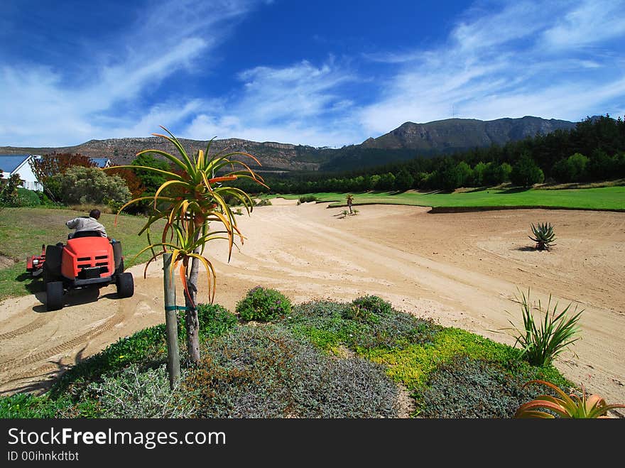 Golf course maintenance on Western Cape golf Course, South Africa. Golf course maintenance on Western Cape golf Course, South Africa