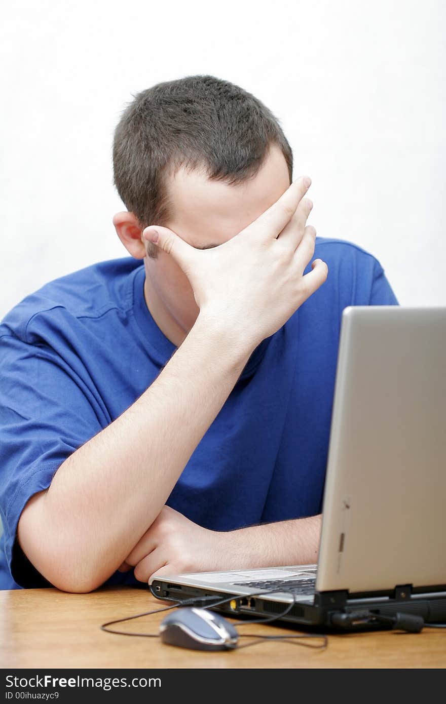 The student works with the portable computer. The student works with the portable computer