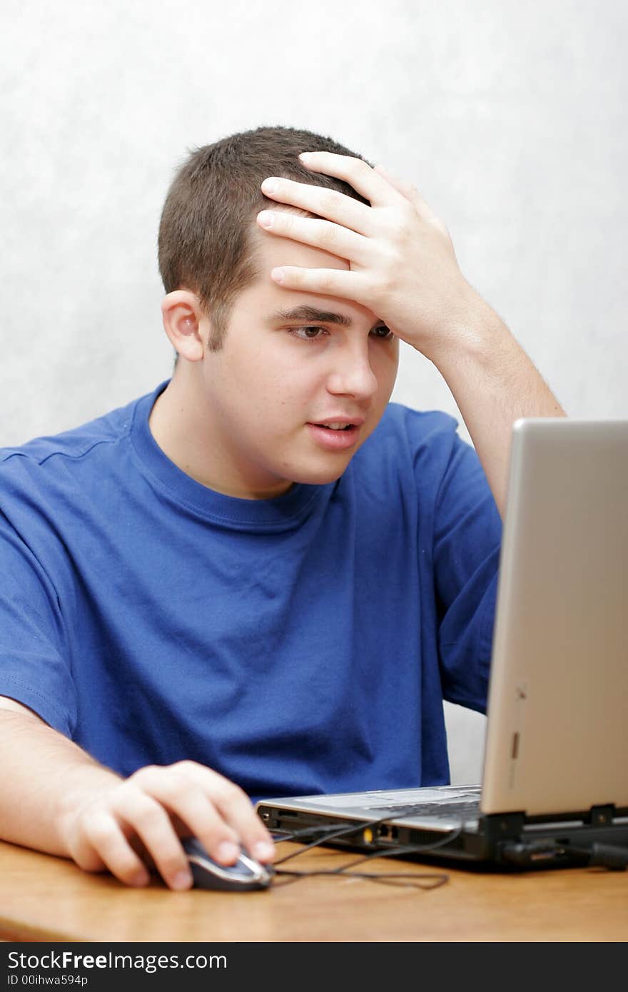 Student working on his laptop