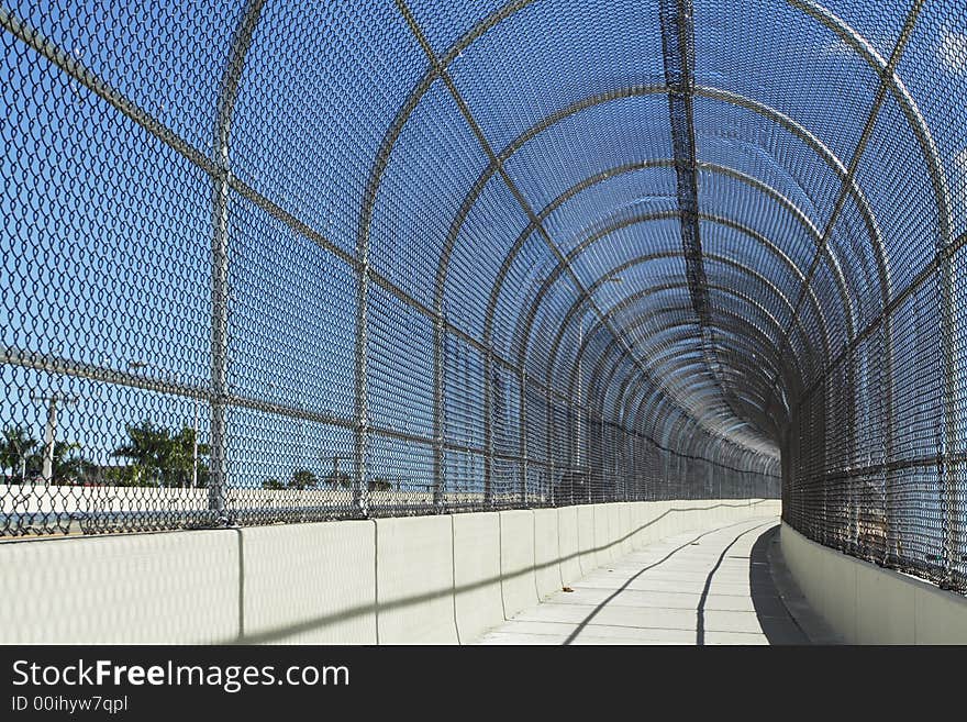 Fenced Walkway On Blue Sky