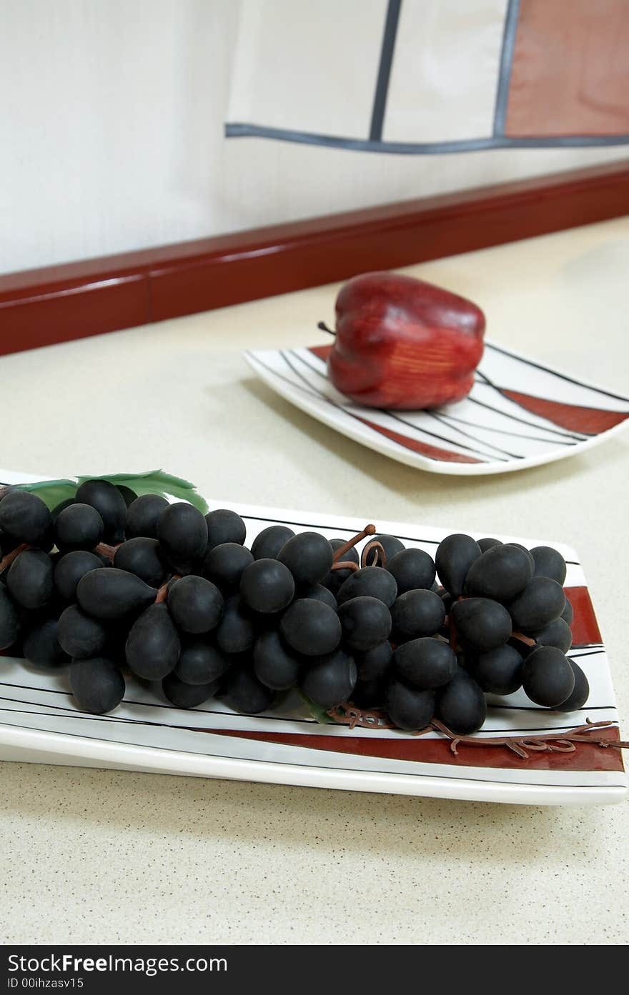 Grapes and apple on modern and beautiful kitchen