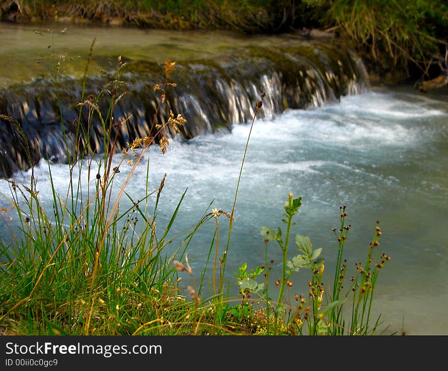 Caucases. The stream flows in mountains.