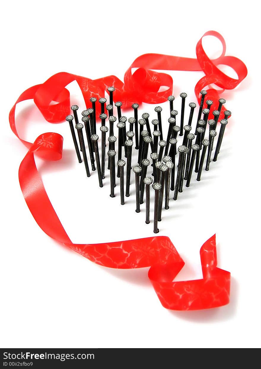 Group of nails as heart on white background