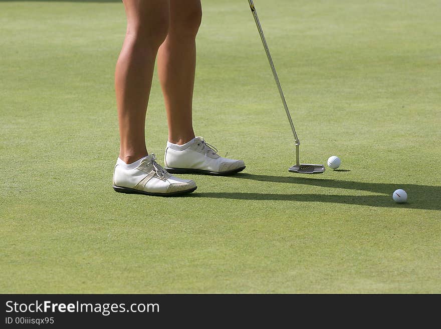 Lady golf putting