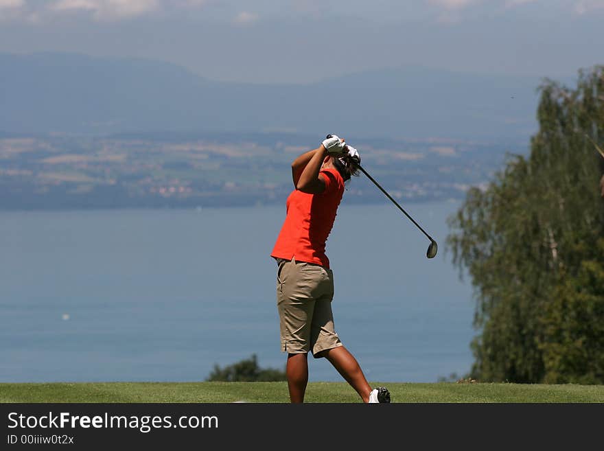 Lady golf swing at Leman lake