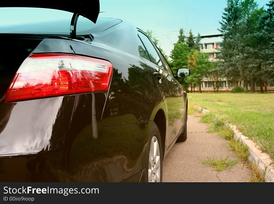 The rear view on the luxury car. The rear view on the luxury car