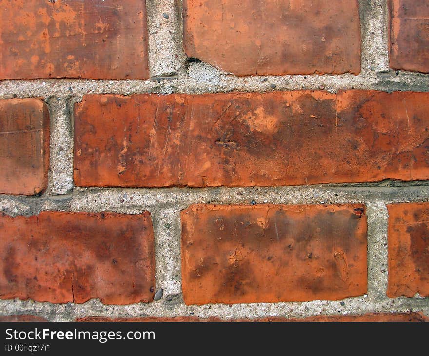 Details of a wall made of brown solid bricks. Details of a wall made of brown solid bricks