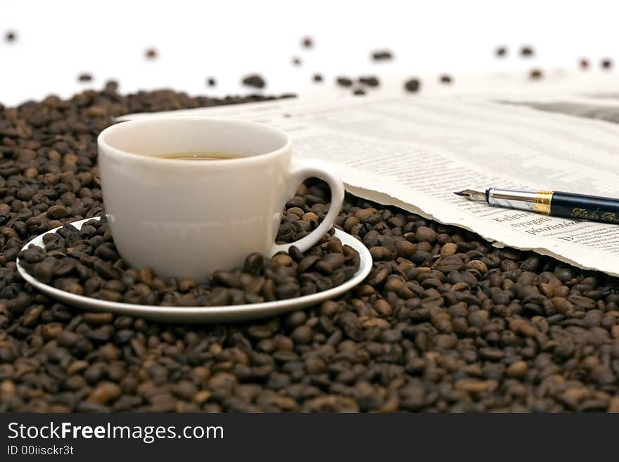 Coffe beans in cup on coffee background