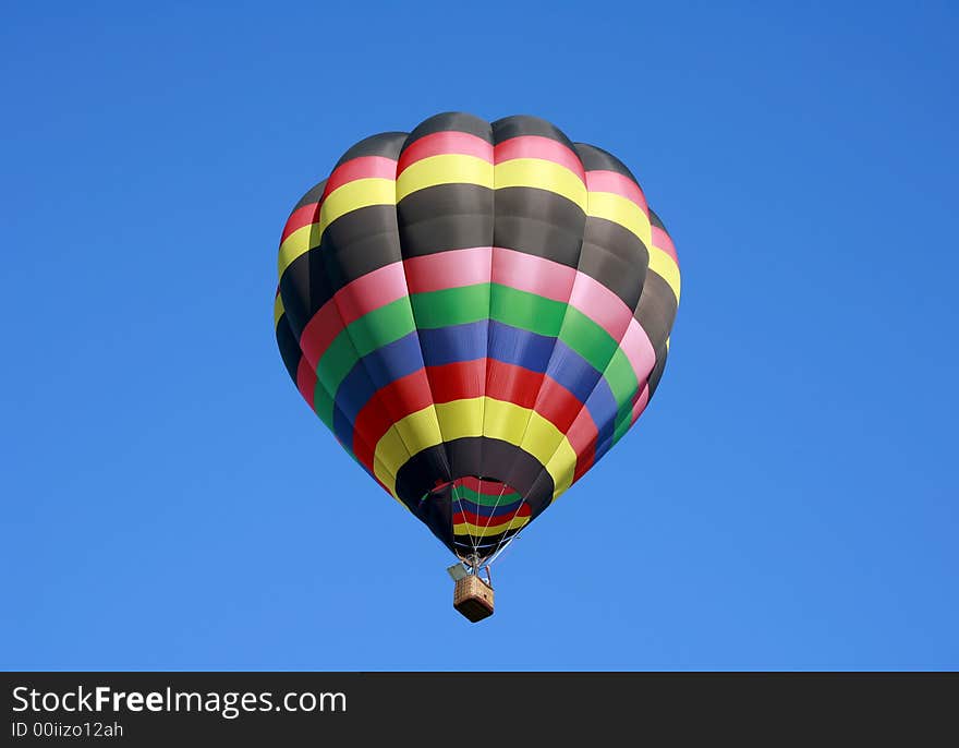 Hot Air Balloon Isolated in the Blue Sky