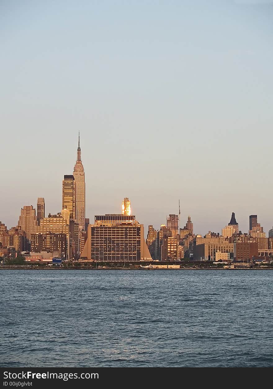 A vertical view of the New York City skyline at dusk. A vertical view of the New York City skyline at dusk.