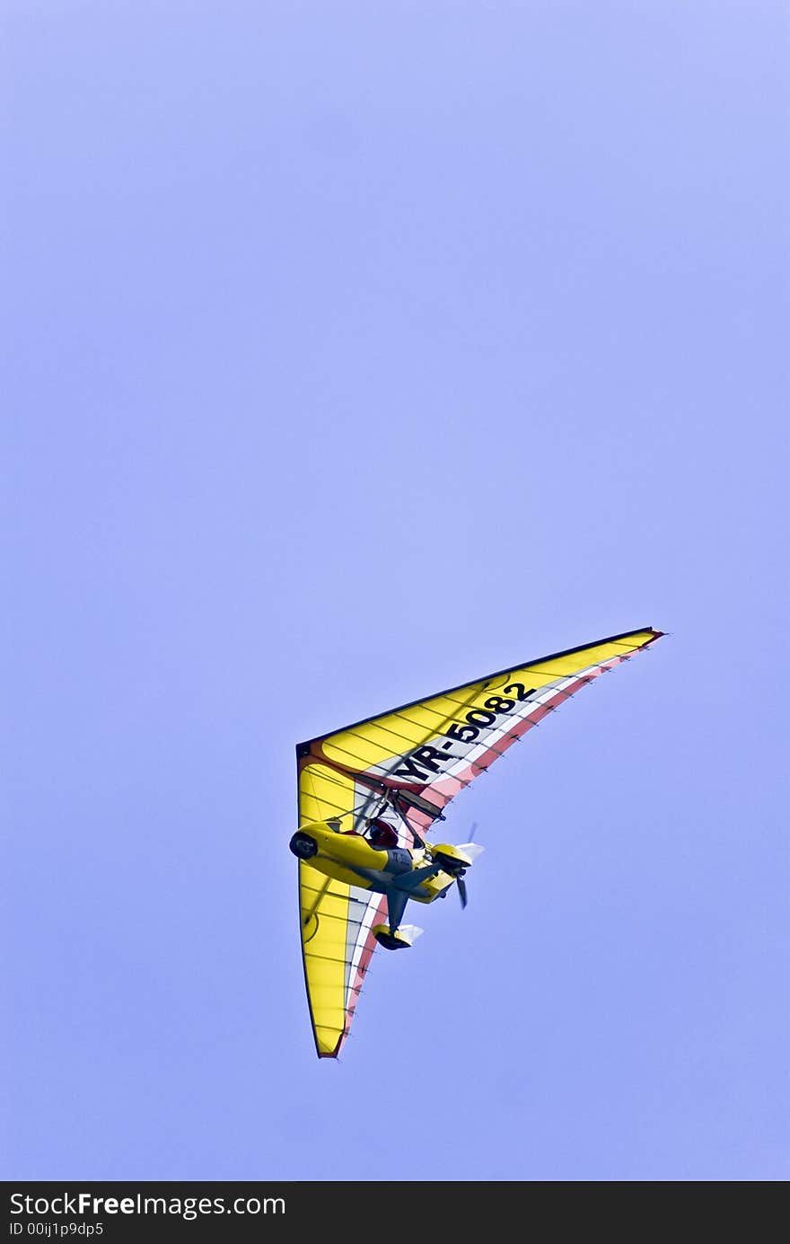 A pilot enjoys the freedom of a powered paraglider. Initials and number changed in PS.