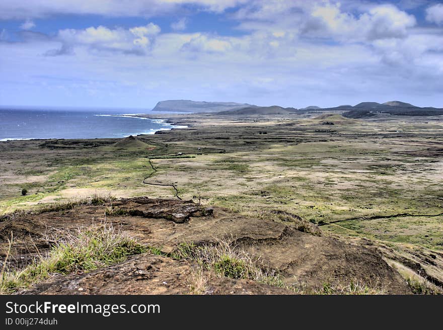 Plateau on the top of a hill with volcanoes in the background. Plateau on the top of a hill with volcanoes in the background