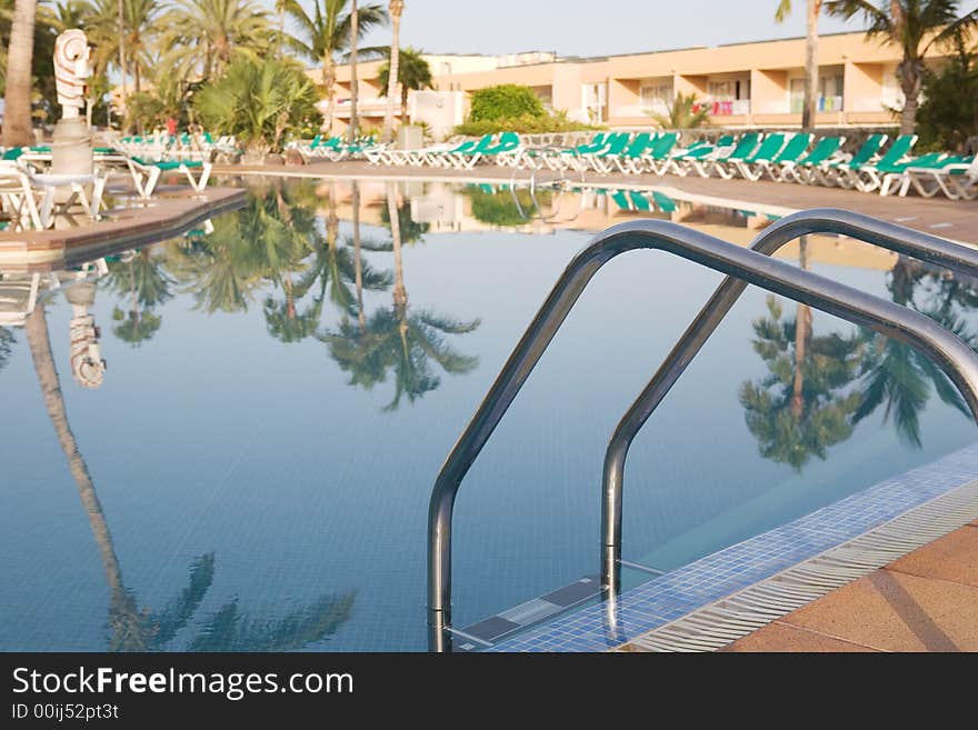 A beautiful pool and sun loungers. A beautiful pool and sun loungers