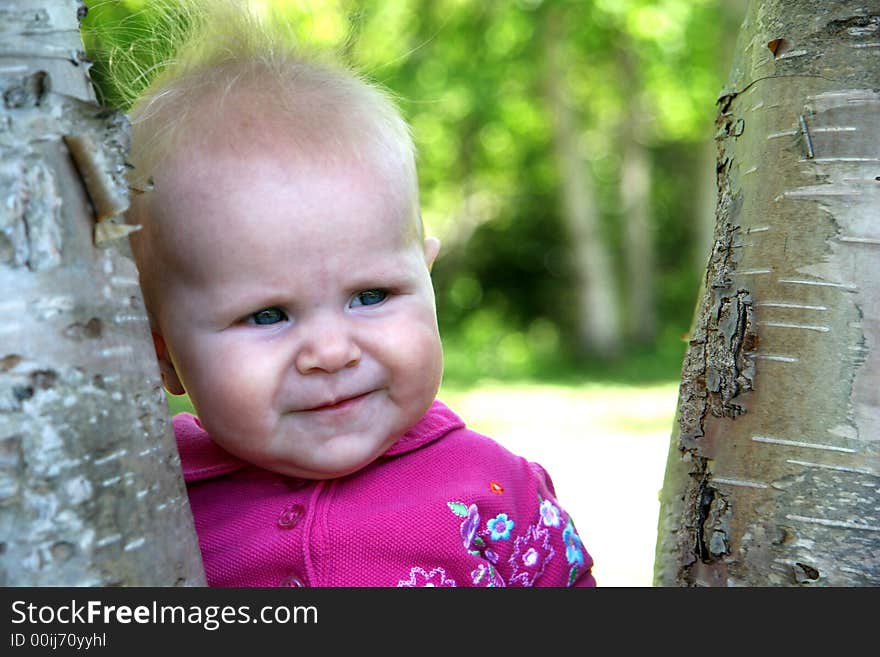 Baby Girl posing in the trees